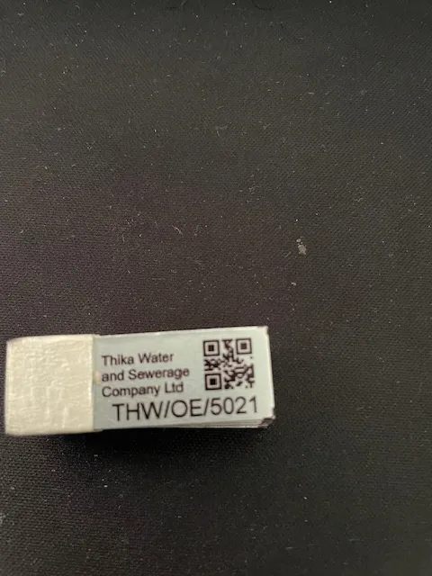 Close-up of a Thika Water and Sewerage Company QR asset tag