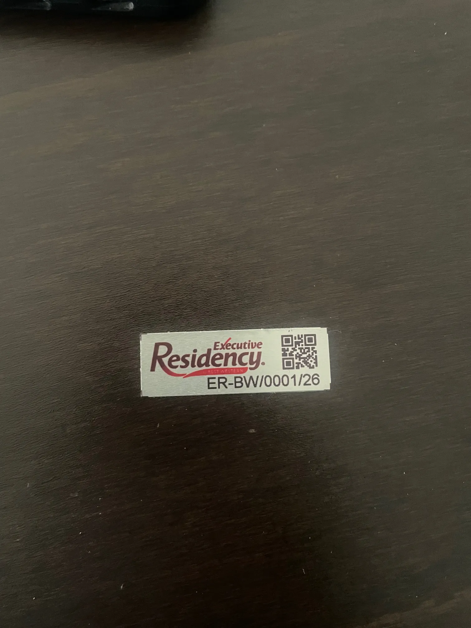 Executive Residency branded QR asset tag produced by STL Asset Solutions