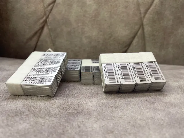 Batches of STL asset tags printed for Vizx Global Solutions