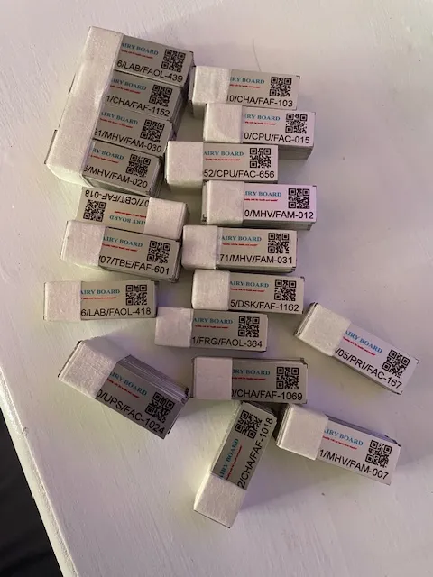 A full batch of STL asset tags ready for chairs, laptops, desks, fridges and UPS units